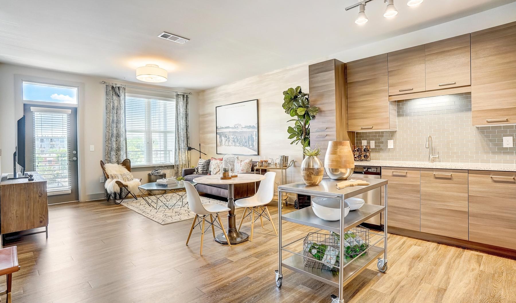 a kitchen with a dining table and chairs