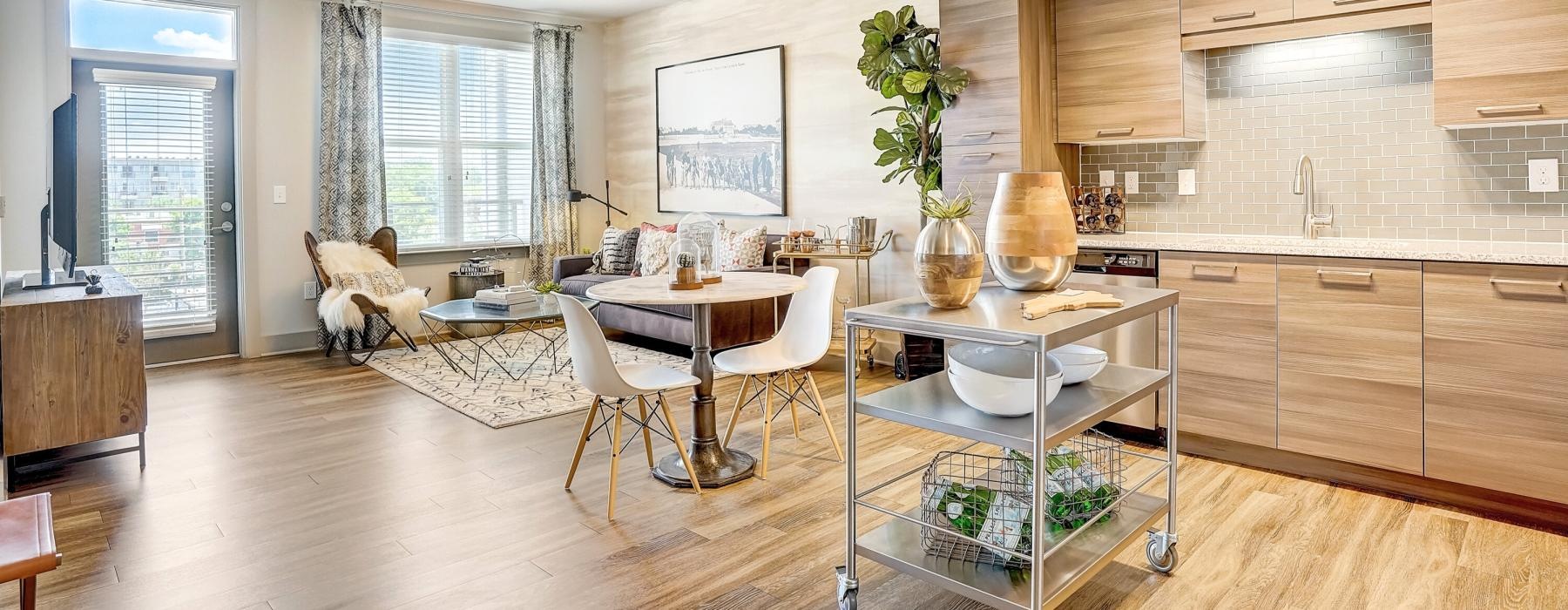 a kitchen with a dining table and chairs