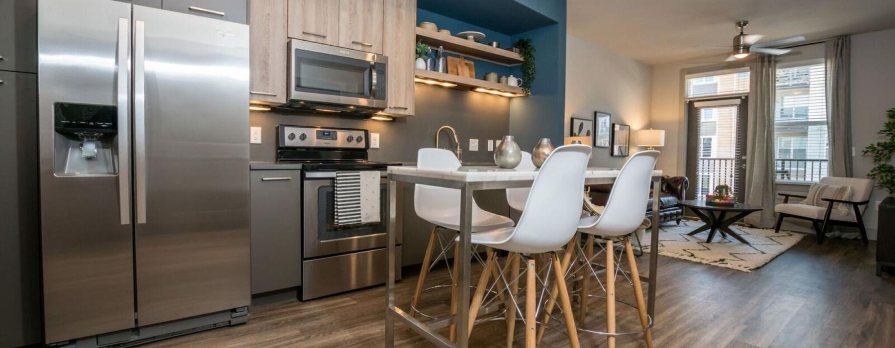 a kitchen with a table and chairs