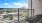 a balcony overlooking a street and buildings